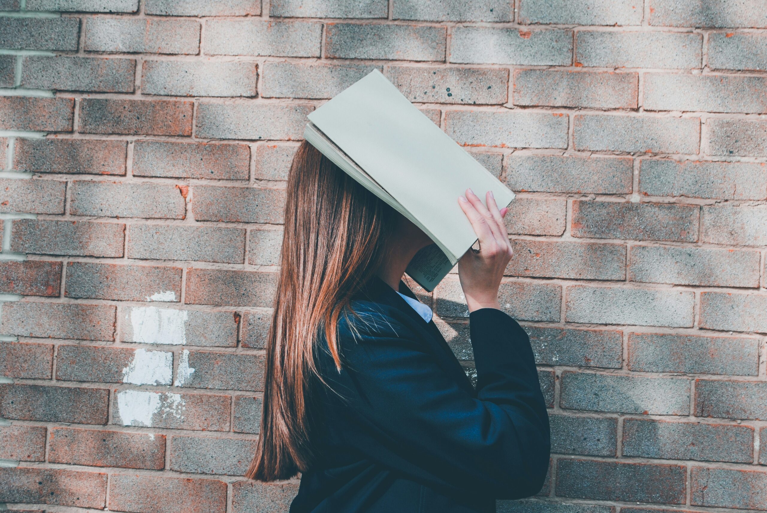 School girl with her dead in a text book